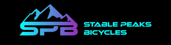 Stable Peaks Bicycles logo with mountain design on a black background